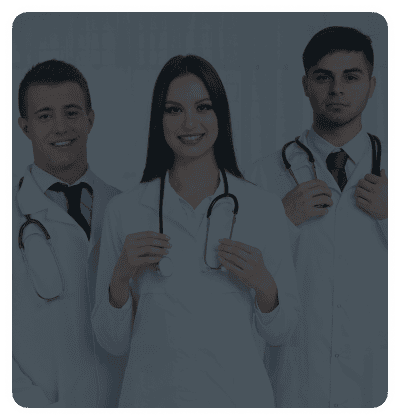 Group of doctors smiling and wearing lab coats.