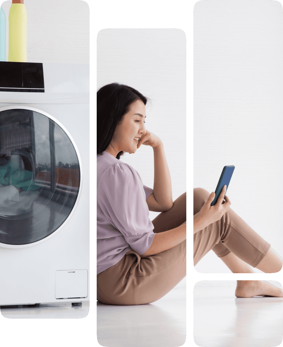 Woman using phone by washing machine